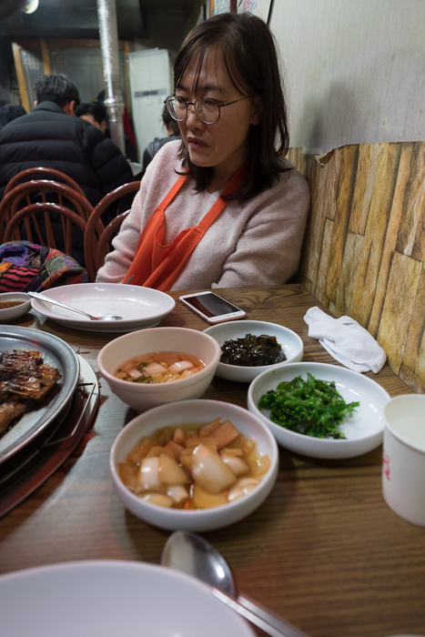 Kyung-ah at the grilled fish restaurant, Sokcho.