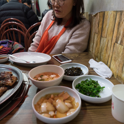 Kyung-ah at the grilled fish restaurant, Sokcho.