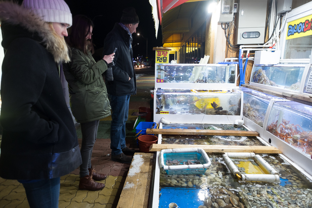 Helen, Marie, and Will admire the catch of the day.