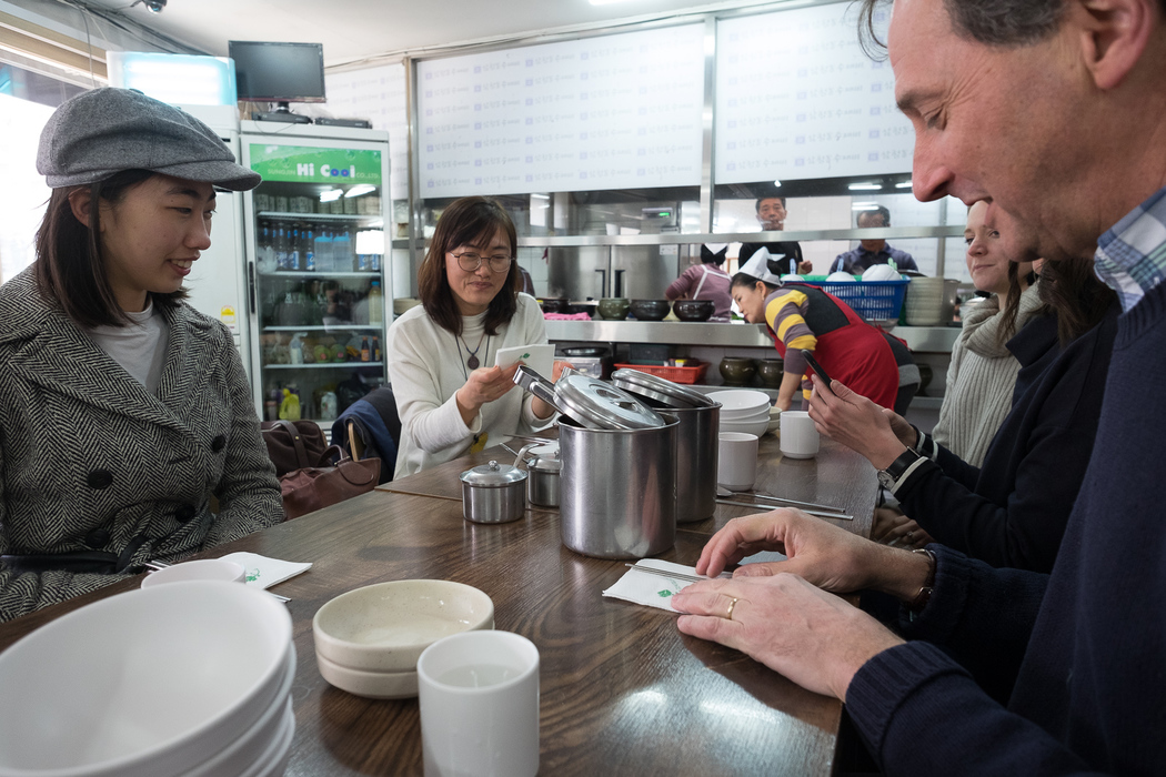 Eating Su Jeoi Bi, a torn-noodle soup.