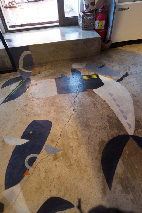 Whales on the kitchen floor, painted by Kyung-ah's younger daughter.