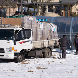 Farmers having trouble with their lorry in the snow. The punchbowl, Yanggu county.