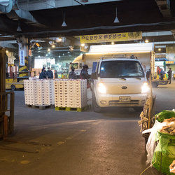 A lorry makes a delivery of fruit at Garak market.